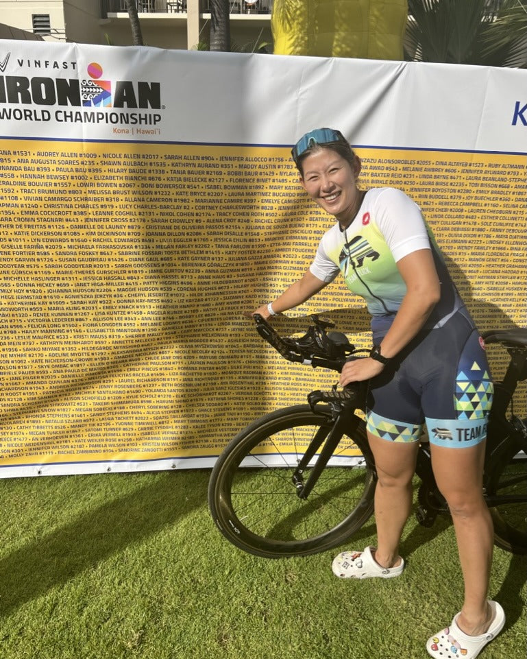 Ha Na pointing at her name at the Ironman World Championship in Kona
