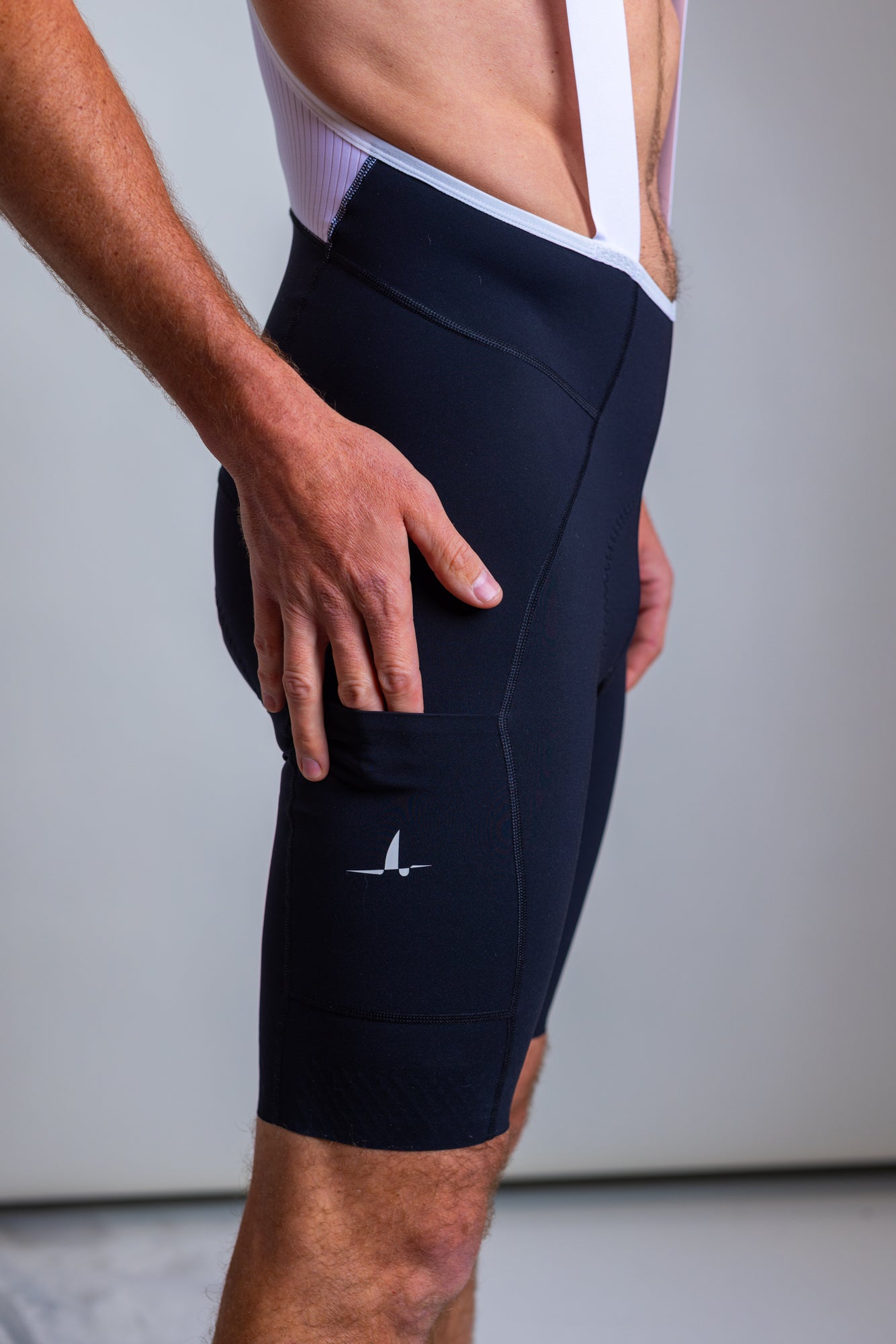 Side view highlighting cargo pocket on Ardei men's cycling bib shorts