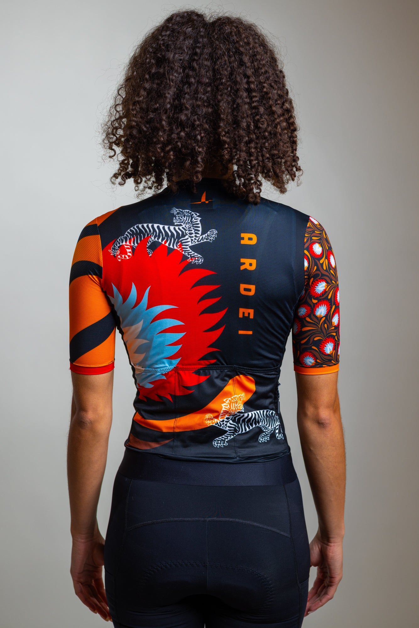 Back view of women's floral cycling jersey – Wild Bloom by Ardei
